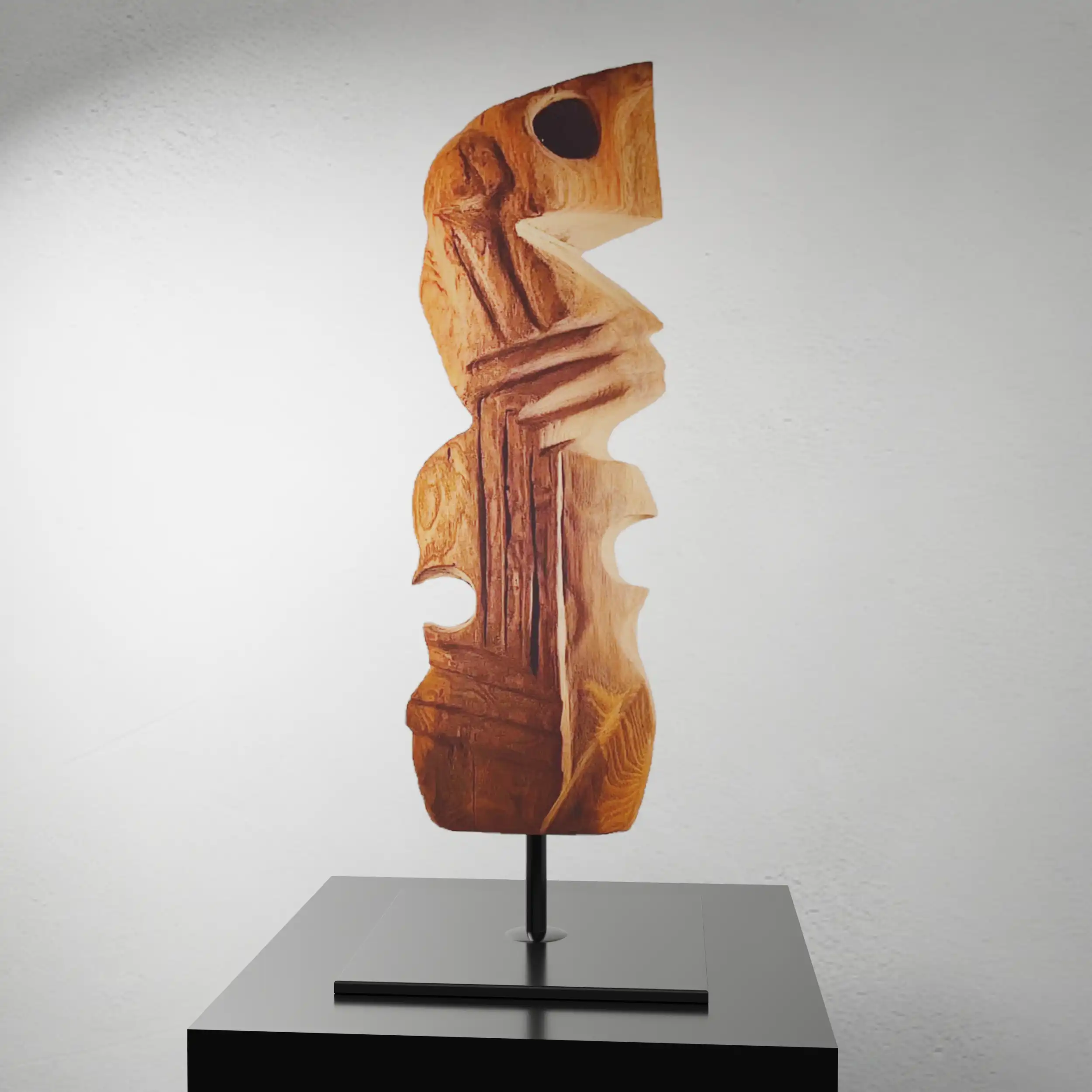 Vertical oak sculpture with carved grooves and angular voids representing jazz bassist Charles Mingus