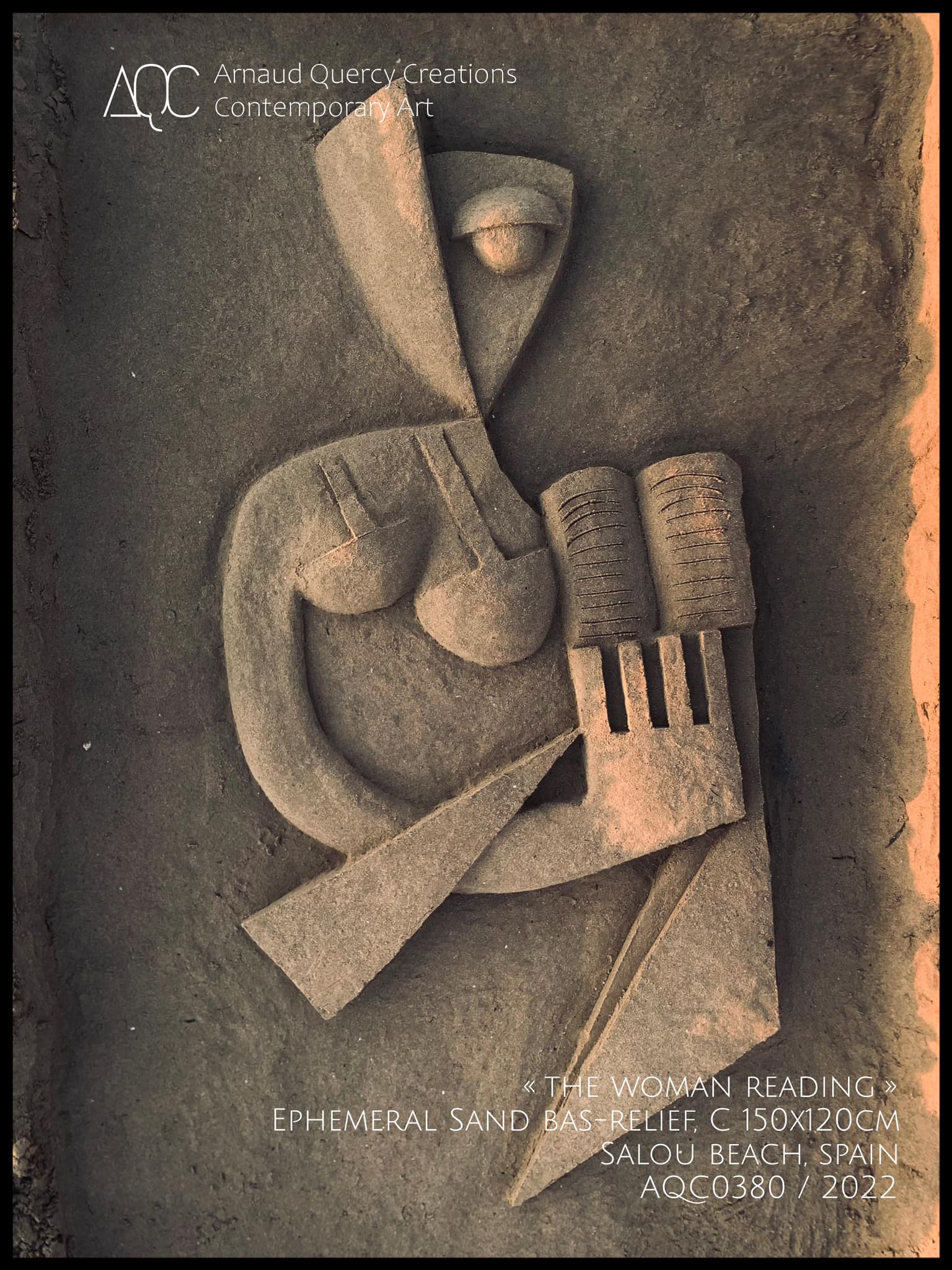 Sand bas-relief of abstract geometric woman reading figure in earth tones, Salou Beach Spain