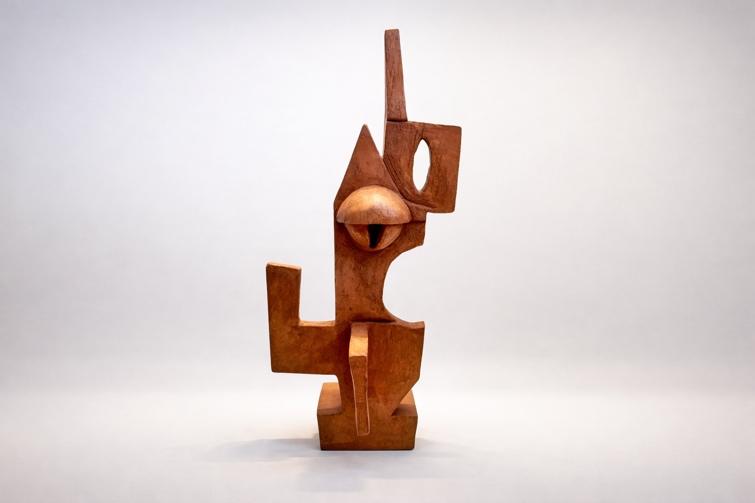 Cubist terracotta sculpture merging feline and architectural forms in warm earth tones with geometric planes