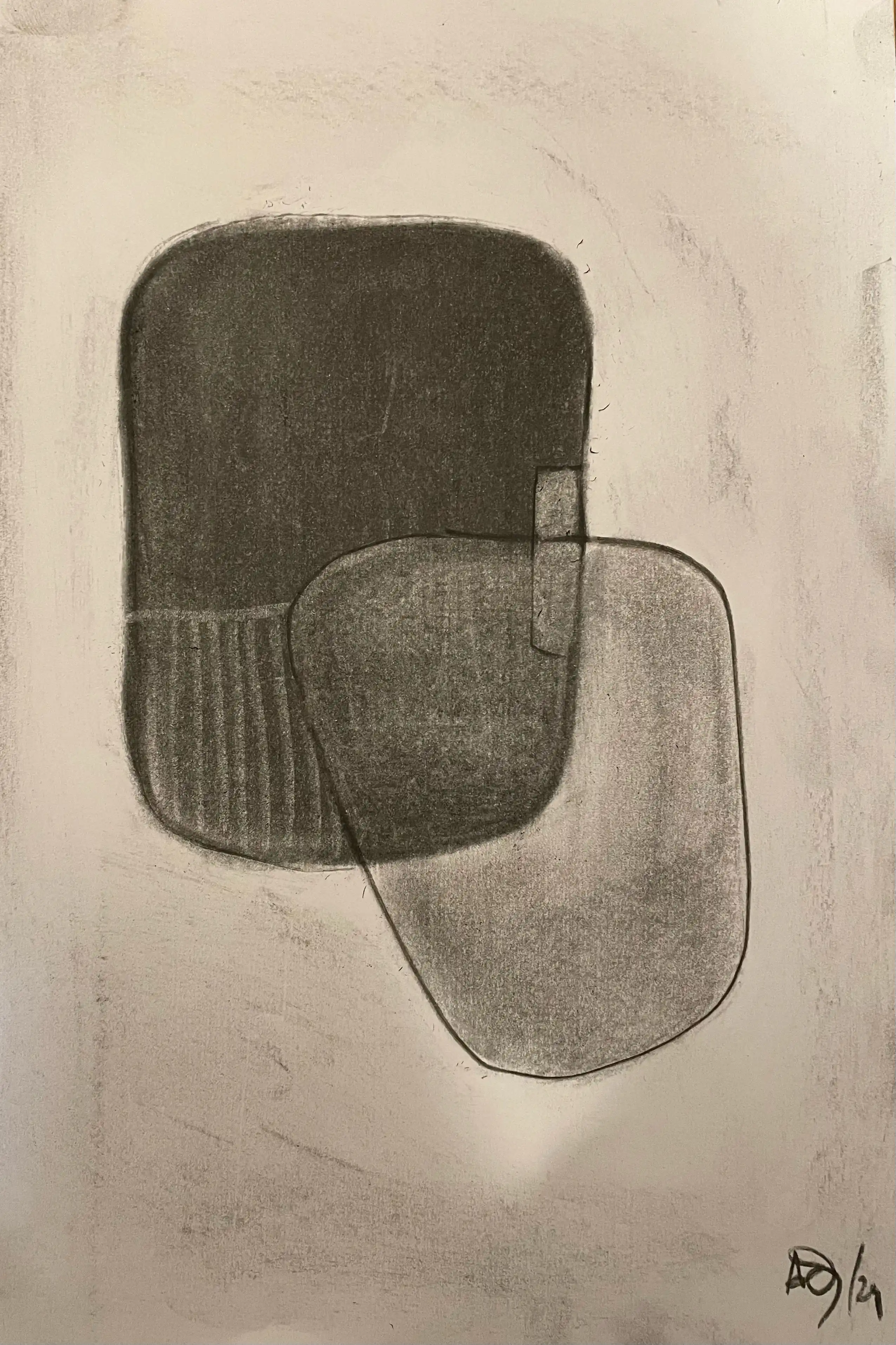 Charcoal drawing with overlapping gray forms creating abstract composition on paper
