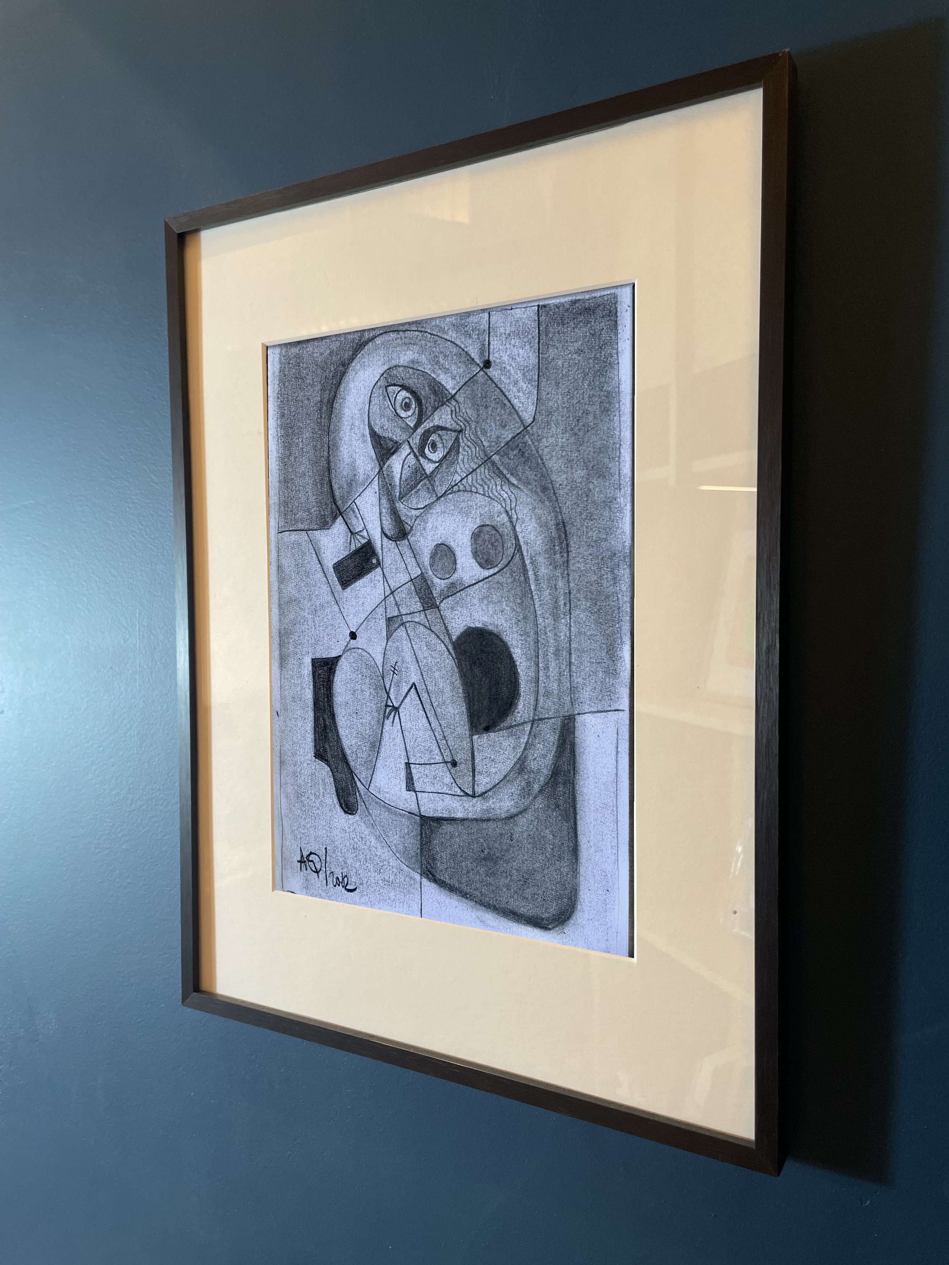 A woman and her phone, charcoal on paper
